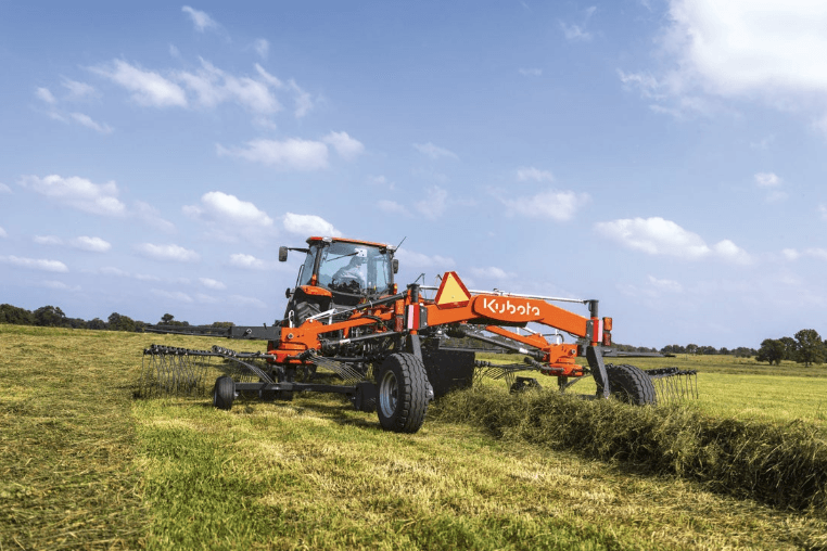 Tractor using Tedder implement