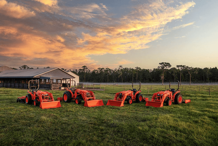 Kubota lineup of tractors on a field