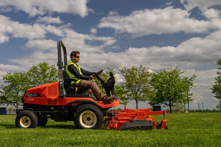 Man mowing with F2690