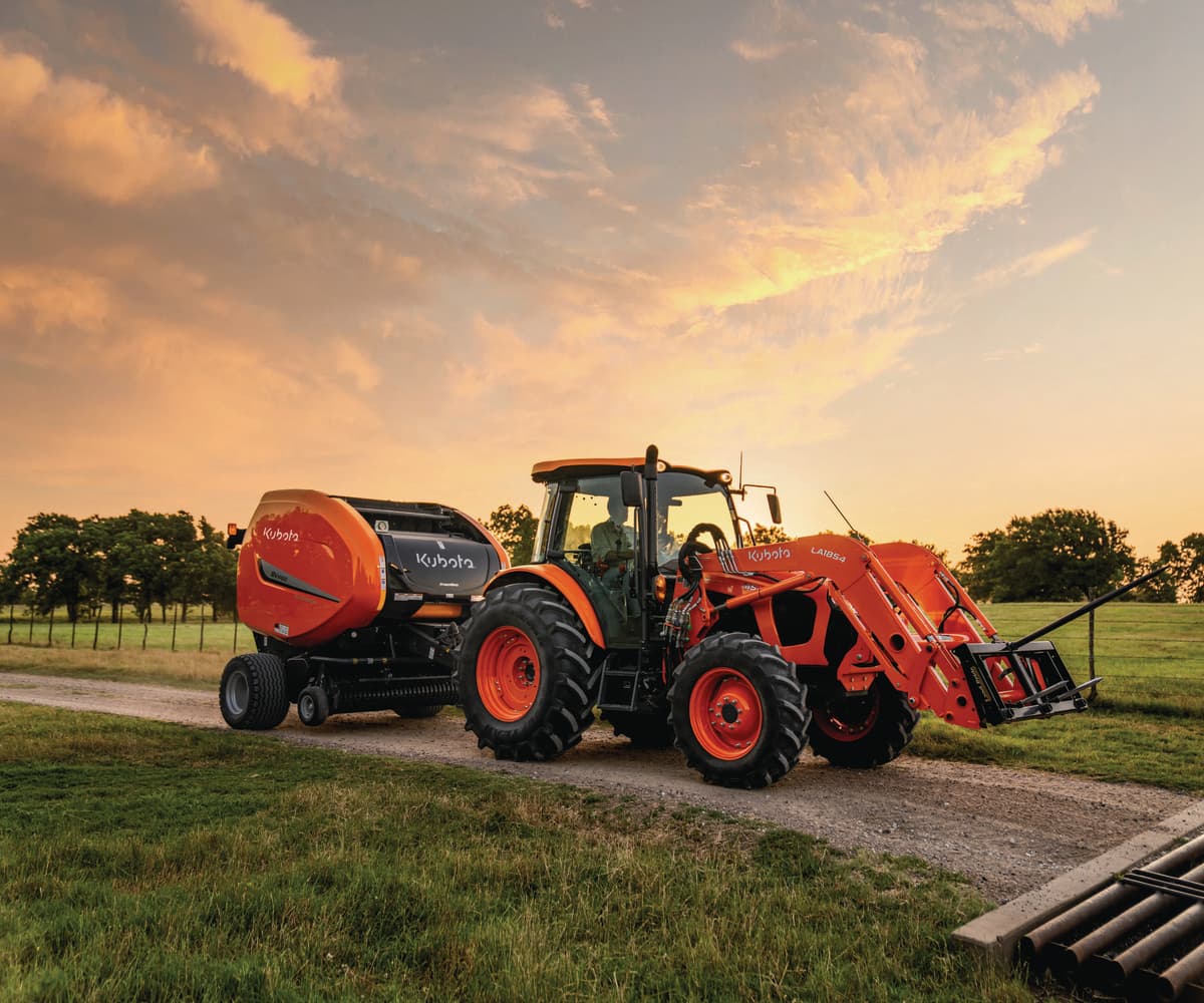 Kubota M5 tractor with baler