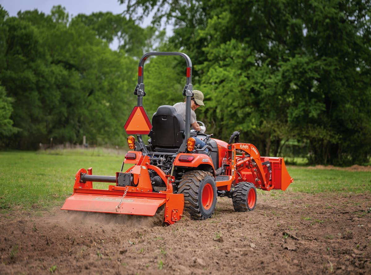Kubota BX Tractor with a box scraper