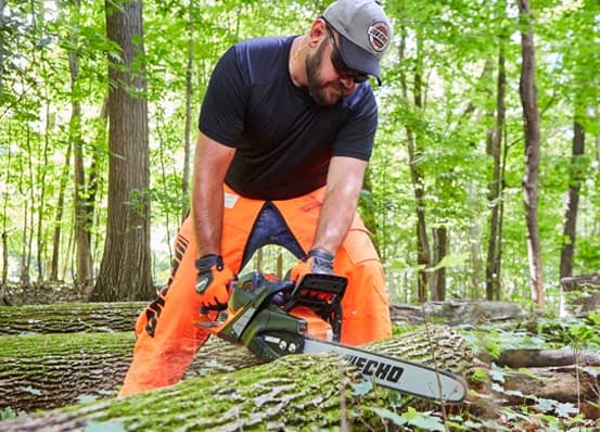Man using an Echo chainsaw